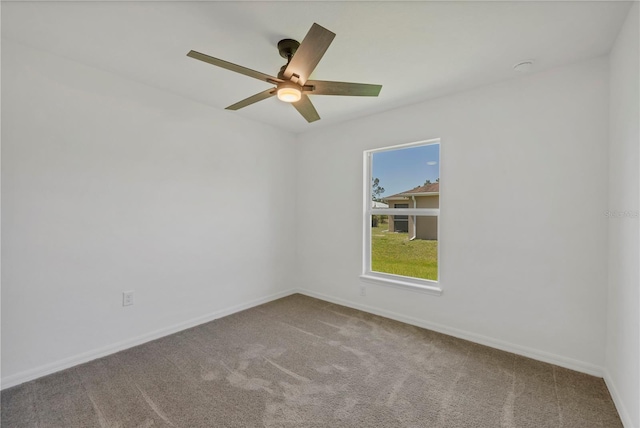 2032 Jagust Rd, North Port, FL 34288 - spare room featuring carpet floors, ceiling fan, and baseboards