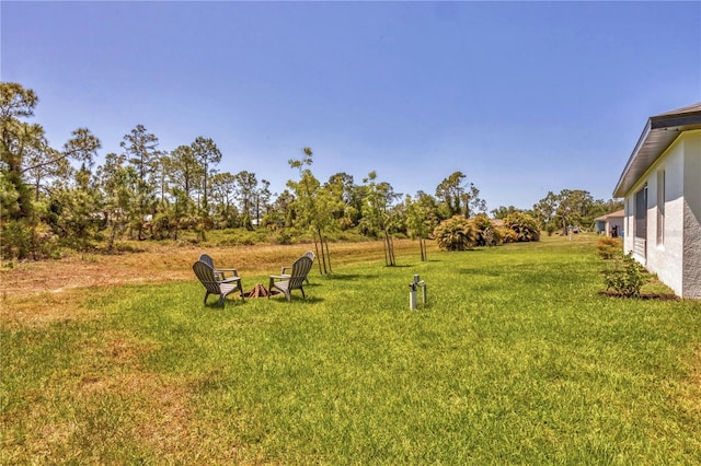 2032 Jagust Rd, North Port, FL 34288 - view of yard featuring an outdoor fire pit