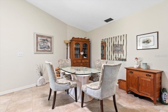 657 Foxwood Blvd, Englewood, FL 34223 - dining space featuring lofted ceiling and baseboards