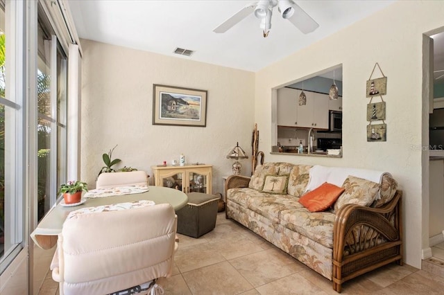 657 Foxwood Blvd, Englewood, FL 34223 - tiled living area with a ceiling fan and a sink