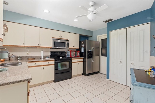 657 Foxwood Blvd, Englewood, FL 34223 - kitchen with stainless steel appliances, backsplash, a ceiling fan, and recessed lighting