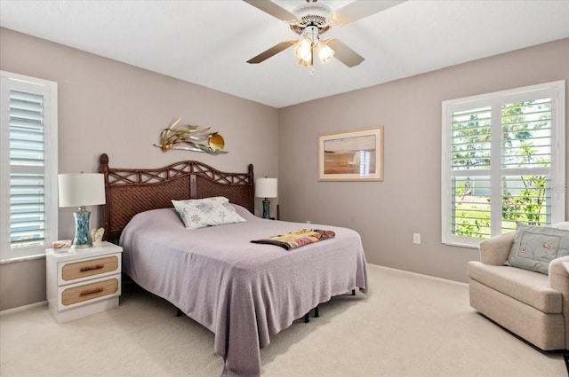 657 Foxwood Blvd, Englewood, FL 34223 - bedroom with light carpet and ceiling fan