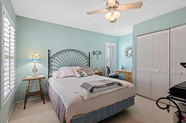 657 Foxwood Blvd, Englewood, FL 34223 - bedroom with light colored carpet, a closet, a ceiling fan, and a desk
