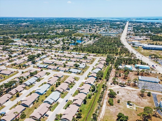 657 Foxwood Blvd, Englewood, FL 34223 - aerial view of property and surrounding area featuring a large body of water and nearby suburban area