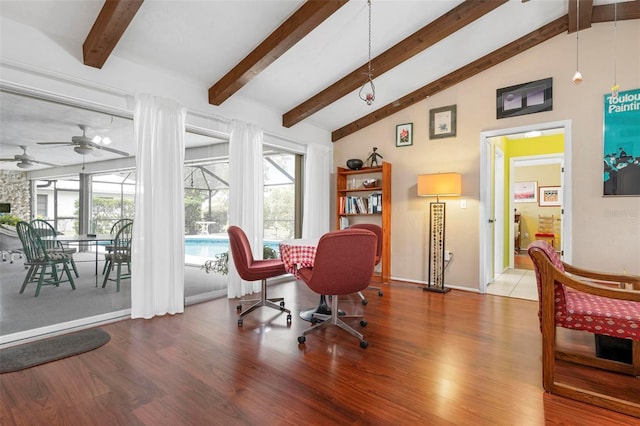 office featuring lofted ceiling with beams, a healthy amount of sunlight, ceiling fan, and wood finished floors