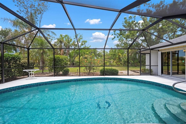 pool with a patio and a lanai