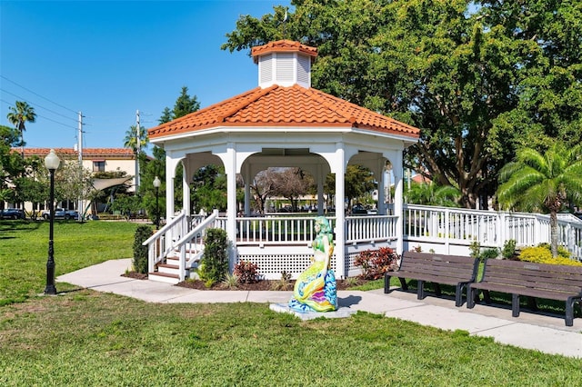surrounding community featuring a gazebo and a lawn