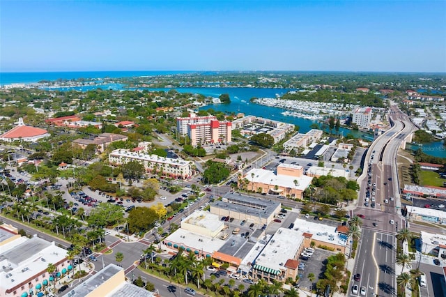 birds eye view of property with a city view and a water view