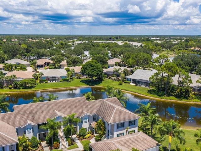 drone / aerial view with a residential view and a water view