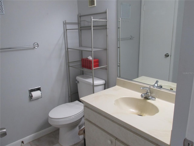618 Bird Bay Dr S Unit 212, Venice, FL 34285 - half bath with toilet, baseboards, visible vents, and vanity