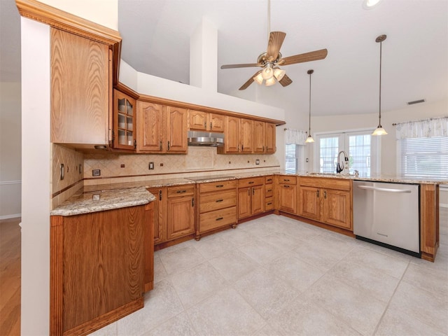 314 Oakwood Cir, Englewood, FL 34223 - kitchen featuring a sink, lofted ceiling, under cabinet range hood, glass insert cabinets, and stainless steel dishwasher