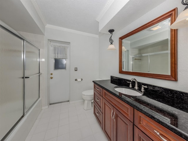 314 Oakwood Cir, Englewood, FL 34223 - bathroom with toilet, crown molding, tile patterned flooring, bath / shower combo with glass door, and vanity