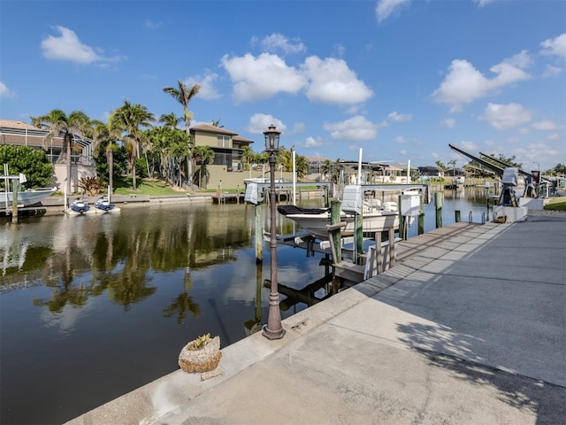 314 Oakwood Cir, Englewood, FL 34223 - dock area featuring boat lift and a water view