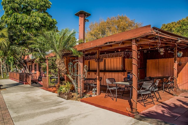 314 Oakwood Cir, Englewood, FL 34223 - view of patio with fence and outdoor dining area