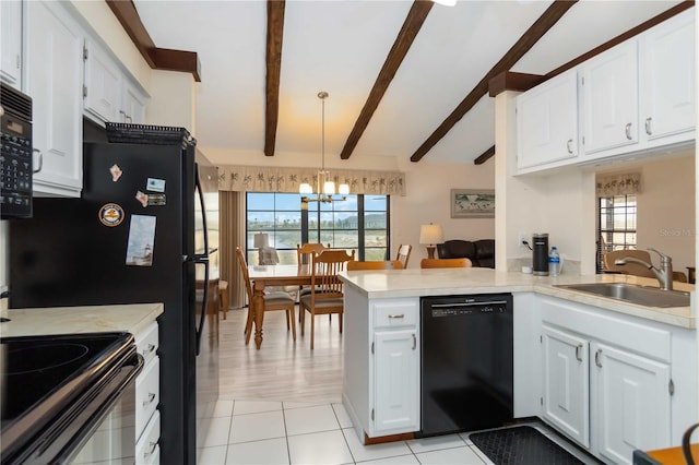 5559 Brassy Loop, North Port, FL 34287 - kitchen featuring black appliances, a sink, a peninsula, a chandelier, and light countertops
