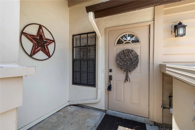 5559 Brassy Loop, North Port, FL 34287 - doorway to property featuring stucco siding
