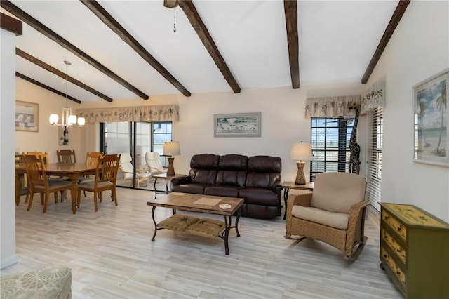5559 Brassy Loop, North Port, FL 34287 - living area featuring healthy amount of natural light, a chandelier, and light wood-style floors