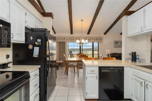 5559 Brassy Loop, North Port, FL 34287 - kitchen featuring black appliances, a chandelier, a peninsula, and white cabinetry