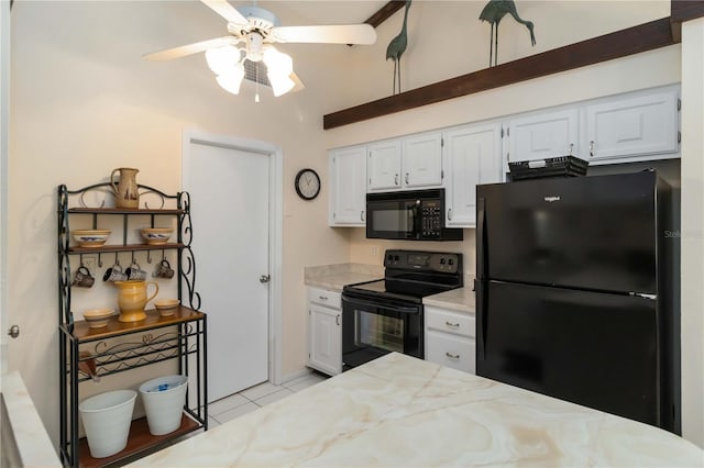 5559 Brassy Loop, North Port, FL 34287 - kitchen with black appliances, a ceiling fan, white cabinets, light tile patterned floors, and high vaulted ceiling