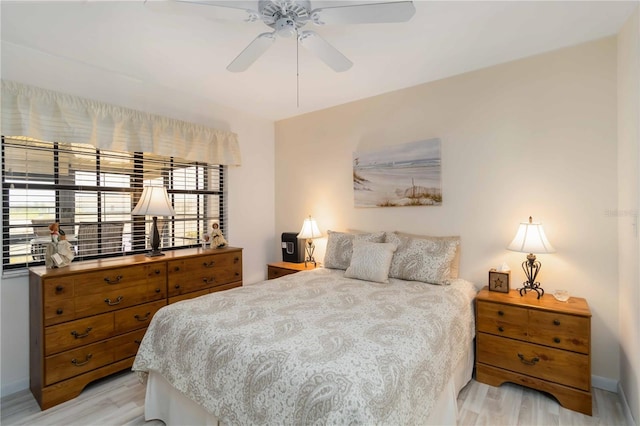 5559 Brassy Loop, North Port, FL 34287 - bedroom featuring light wood-style flooring, ceiling fan, and baseboards