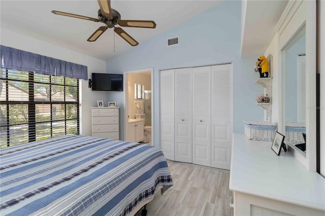 5559 Brassy Loop, North Port, FL 34287 - bedroom with lofted ceiling, a closet, light wood finished floors, ceiling fan, and connected bathroom
