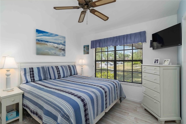 5559 Brassy Loop, North Port, FL 34287 - bedroom with light wood-type flooring, baseboards, and ceiling fan