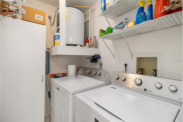 5559 Brassy Loop, North Port, FL 34287 - laundry room featuring water heater and washing machine and clothes dryer