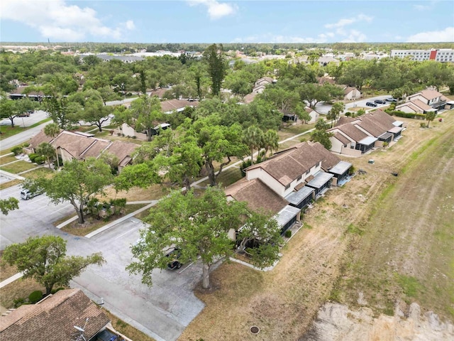 5559 Brassy Loop, North Port, FL 34287 - aerial perspective of suburban area featuring a tree filled landscape