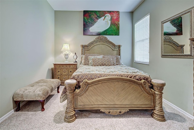 carpeted bedroom featuring baseboards