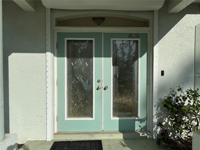 1483 Prairie Ter, North Port, FL 34286 - entrance to property with french doors and stucco siding