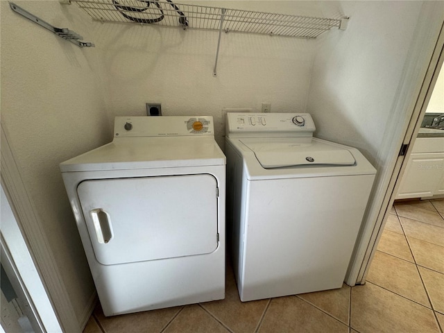 1483 Prairie Ter, North Port, FL 34286 - laundry room featuring separate washer and dryer and light tile patterned floors