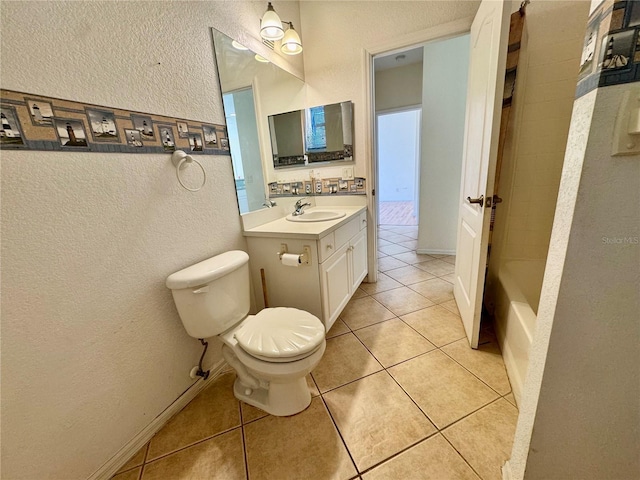1483 Prairie Ter, North Port, FL 34286 - bathroom with a textured wall, toilet, vanity, tile patterned floors, and shower / tub combo