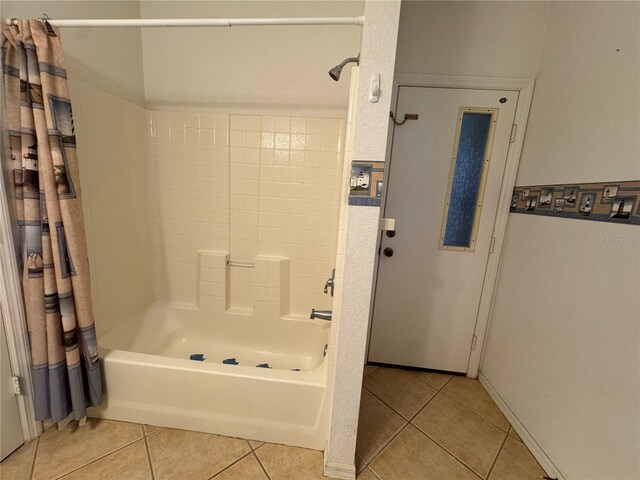 1483 Prairie Ter, North Port, FL 34286 - bathroom with shower / tub combo with curtain and tile patterned floors