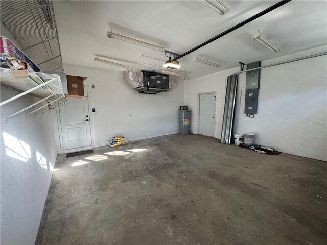 1483 Prairie Ter, North Port, FL 34286 - garage featuring water heater, electric panel, and a garage door opener