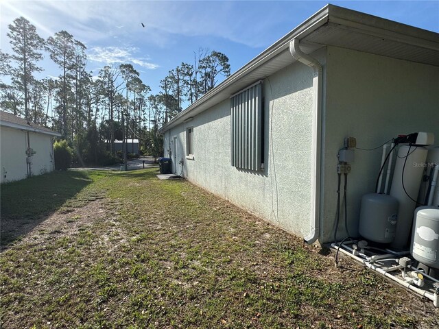 1483 Prairie Ter, North Port, FL 34286 - view of side of property with stucco siding