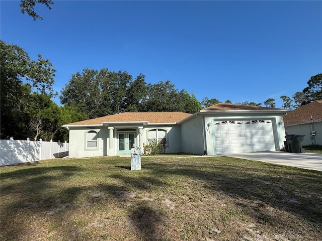 1483 Prairie Ter, North Port, FL 34286 - view of front of house featuring french doors, driveway, a garage, and stucco siding