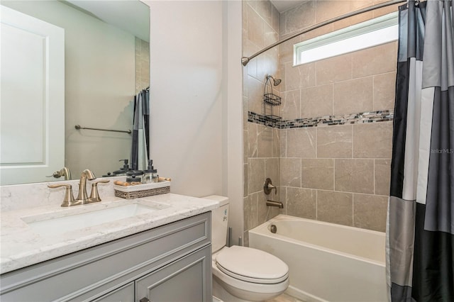bathroom featuring shower / bath combination with curtain, toilet, and vanity