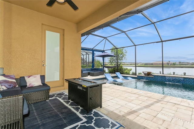 view of patio featuring an outdoor living space with a fire pit, ceiling fan, an outdoor pool, a water view, and glass enclosure