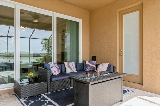 view of patio / terrace featuring a fire pit and a water view