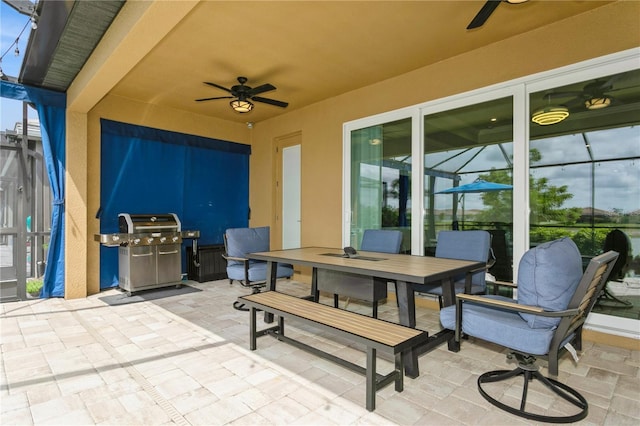 view of patio / terrace featuring ceiling fan, a grill, and outdoor dining area
