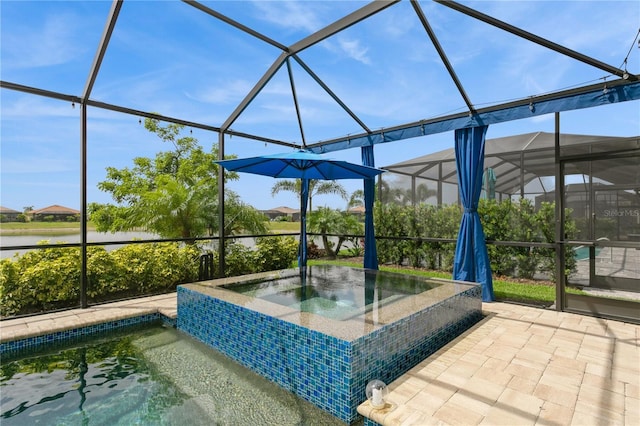 view of patio / terrace featuring an in-ground hot tub, a lanai, and a water view