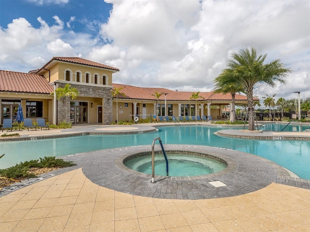 community pool featuring a community hot tub