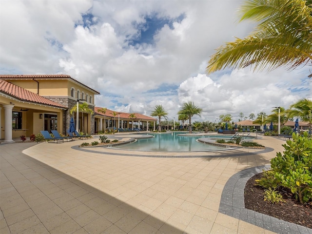 community pool featuring a patio area