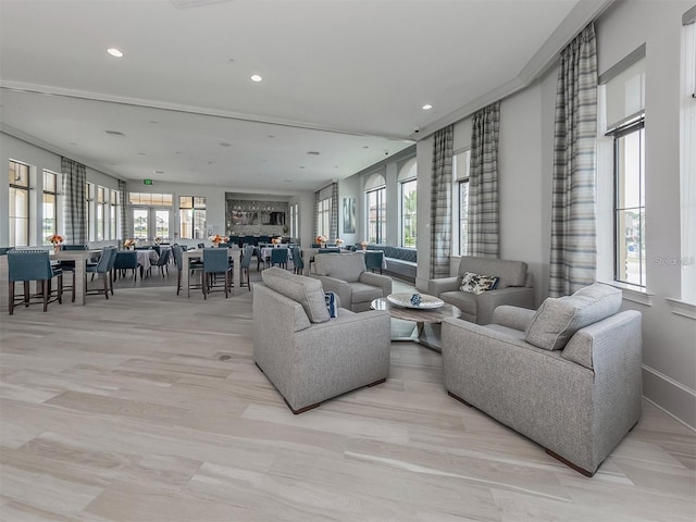 living area with recessed lighting and baseboards
