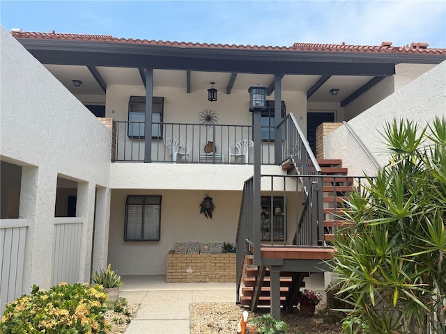 744 Avenida Estancia Unit 144, Venice, FL 34292 - exterior space with stairway and stucco siding