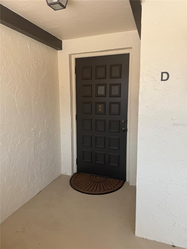 744 Avenida Estancia Unit 144, Venice, FL 34292 - doorway to property featuring stucco siding
