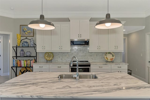 kitchen with appliances with stainless steel finishes, baseboards, light stone counters, white cabinetry, and decorative backsplash
