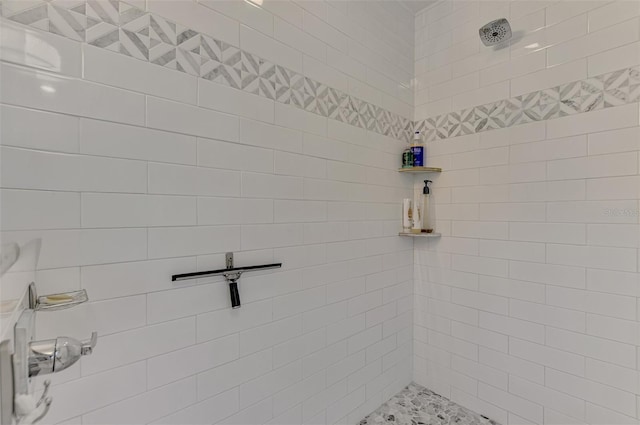 full bathroom with tiled shower