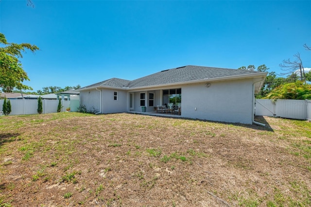back of property featuring stucco siding and a patio area