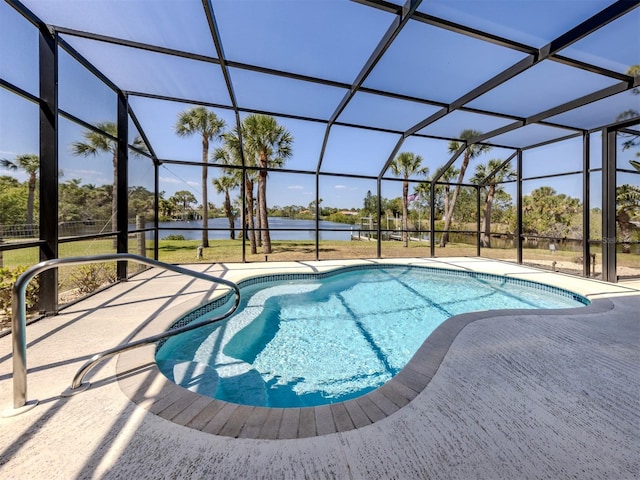 pool with a patio, a water view, and a lanai